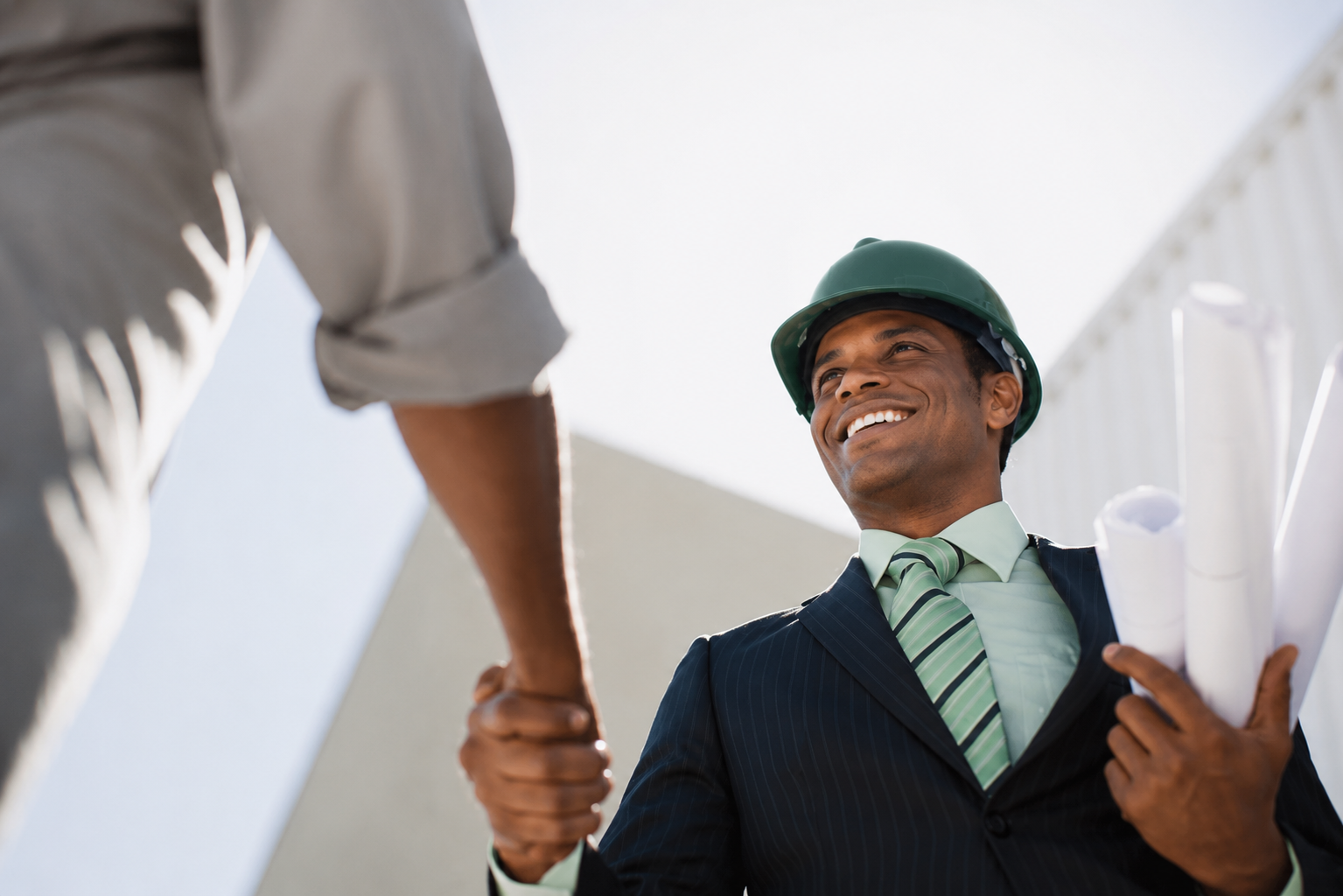 Precision Properties handshake on construction site